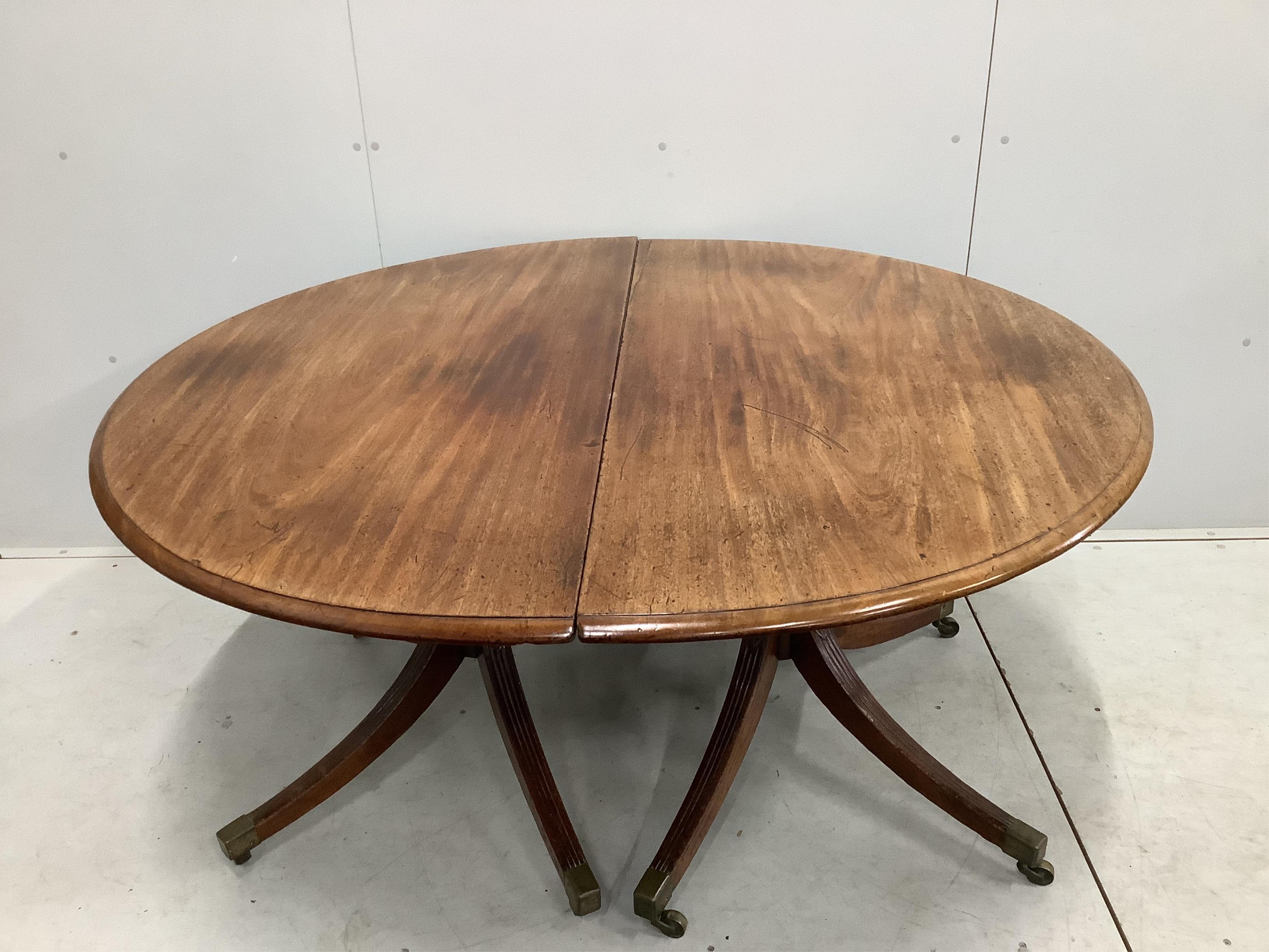 A Regency mahogany D end extending dining table, 232cm extended, one spare leaf, depth 140cm, height 73cm. Condition - poor to fair